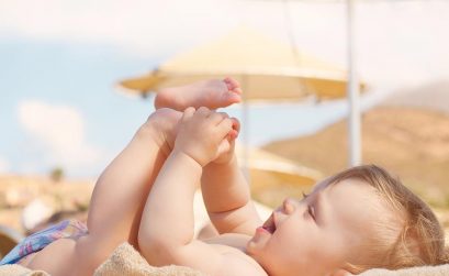 happy baby on beach